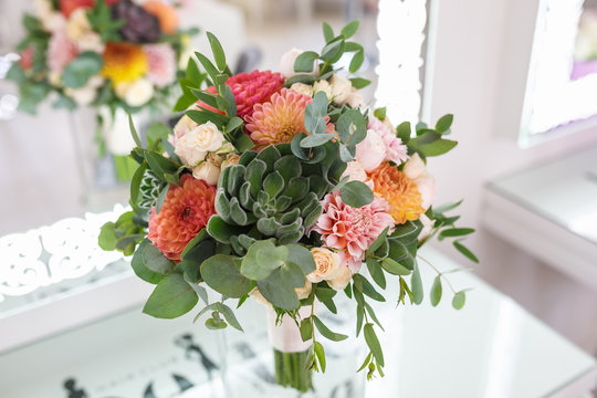bright wedding bouquet of summer dahlias and roses