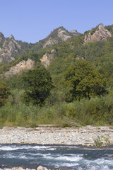 Beautiful landscape with river and mountains. The White river is in the North Caucasus