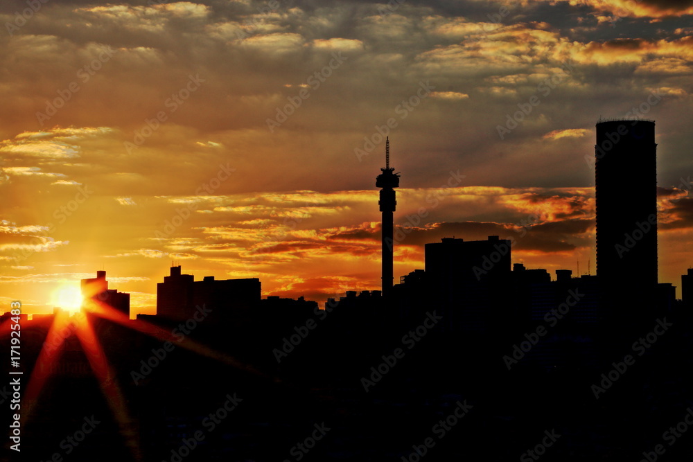 Wall mural silhouette view of the johannesburg skyline at sunset