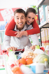 Cheerful couple doing shopping
