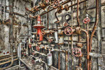 Derelict industrial boiler room in a disused factory