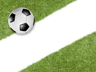 Soccer ball on green turf with diagonal white line
