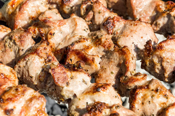 Shashlik prepares on the mangal. Close up.