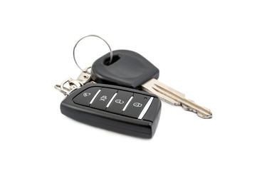 Car remote control with key on white.
