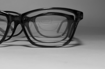 Rimmed eyeglasses closeup on a white background