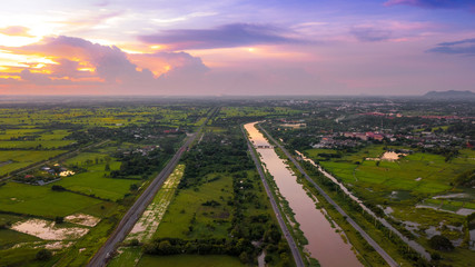 Aerial Photo canal and Railway Countryside Green Field Beautiful Sky Lopburi Thailand