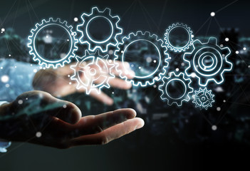Businessman holding hand-drawn gears icons