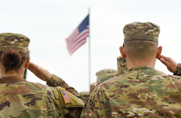 American Soldiers Saluting US Flag - obrazy, fototapety, plakaty