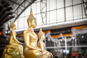 Buddha statue gold color with high contract.