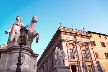 Fototapeta premium Marble statues of the Dioscuri, Castor and Pollux, at the top of the staircase, with Capitol Square or Piazza del Campidoglio in background. Rome, Italy.