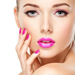 eautiful woman face with pink makeup of eyes and nails. © Valua Vitaly