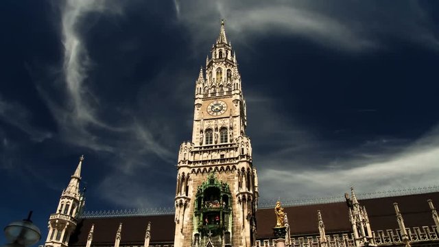 Hyper time lapse moving on Marienplatz square with Munich Rathaus historical city town hall on cloudy day Germany Bavaria timelapse hyperlapse