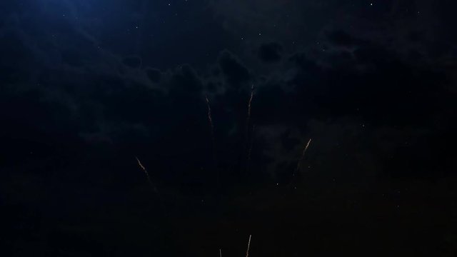 2018 Happy New Year greeting text in Bengali with particles and sparks on black night sky with colored slow motion fireworks on background, beautiful typography magic design.