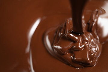 pouring melted premium dark chocolate from above