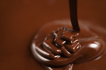 pouring melted premium dark chocolate from above