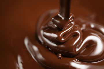 pouring melted premium dark chocolate from above
