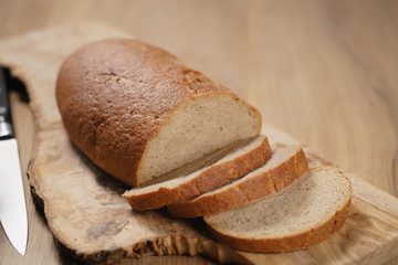 sliced rye wheat rustic bread on cutting board