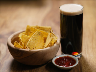 dark beer with nachos and salsa sauce