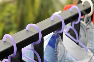 Clothing on hanger at terrace rail in condominium property, it's prohibited property.