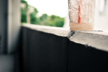 garbage of iced coffee in glass, water drops on the plastic glass of iced coffee, garbage concept, pollution concept in the city