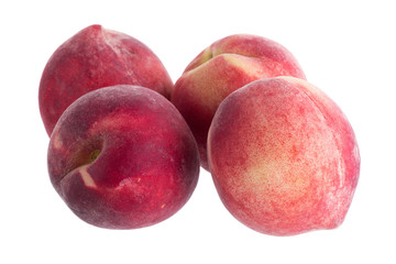 Ripe fresh peaches isolated on white background