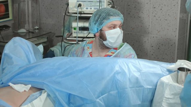 Doctor looking at the display during endoscopy surgery
