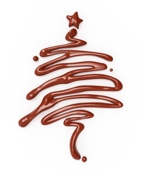 Christmas fir tree made from chocolate or brown liquid on white background.
