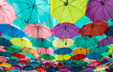 many colorful umbrellas protecting the sunlight