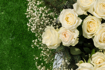 Autumn composition of wild and ornamental flowers . Bouquet on green background of artificial grass.