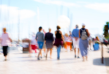 Cannes, ITALY.  Le Vieux Port of Cannes. Blur of people walking on the Yachting festival in front of the main harbour