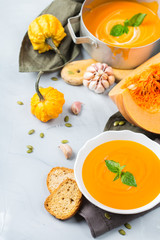 Fall autumn roasted orange pumpkin carrot soup with garlic
