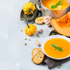 Fall autumn roasted orange pumpkin carrot soup with garlic