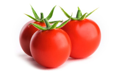Three tomatoes on white