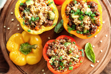Quinoa stuffed peppers on wooden board
