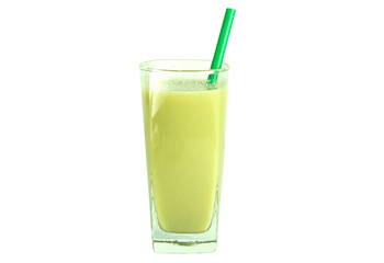 Healthy green smoothie with green straw in a clear tall glass isolated on white