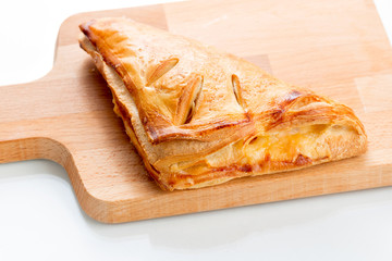 Puff pastry pies with with honey, berries and nuts .