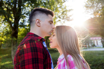 summer holidays, love, romance and people concept - happy smiling young couple outdoors