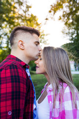 summer holidays, love, romance and people concept - happy smiling young couple outdoors