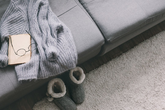 Sweater and reading on sofa