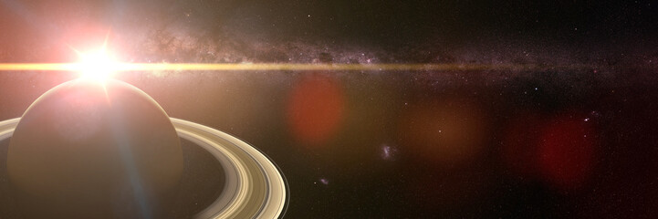 beautiful sunrise over the planet Saturn with Milky Way galaxy in background © dottedyeti