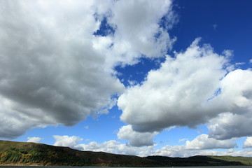 Obraz na płótnie Canvas landscape with clouds on blue sky