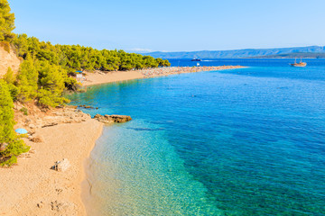 View of famous Zlatni Rat beach with beautiful sea water in Bol town, Brac island, Croatia
