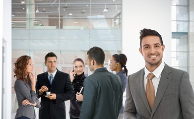 Portrait of successful businessman smiling happy