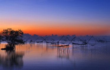 unique dip fishing net used by fishermen and women for catching prawns from the freshwater lake located in Phatthalung province, Thailand