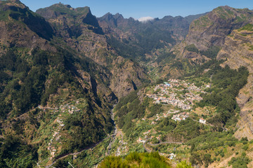 Madeira. Eira do Serrado viewpoint. In the background the village of Curral das Freiras - 171953246
