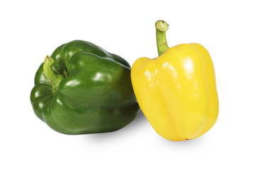 Green and yellow bell peppers Split white background