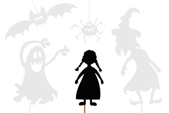 Little girl's shadow puppets surrounded by shades of Halloween monsters, isolated.
