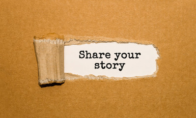 The text Share your story appearing behind torn brown paper