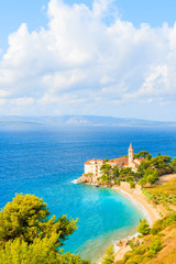 View of sea bay and beach with famous Dominican monastery in Bol town, Brac island, Croatia
