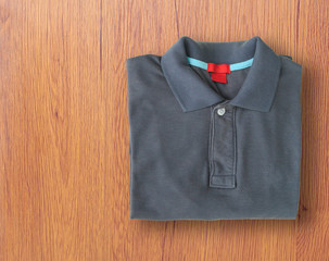polo shirts on wooden